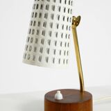 A pair of mid-century modern bedside lamps with perforated metal shades