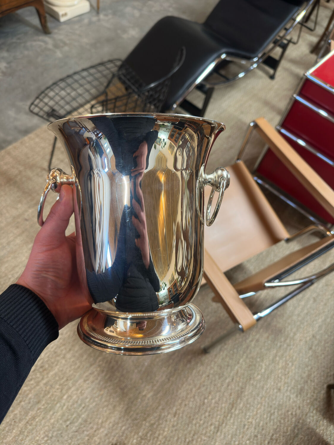 Silver-plated champagne bucket with ring handles.