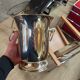 Silver-plated champagne bucket with ring handles.