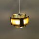 Danish hanging lamp, made in brass colored and brown metal, with yellowish hard pressed plastic deta