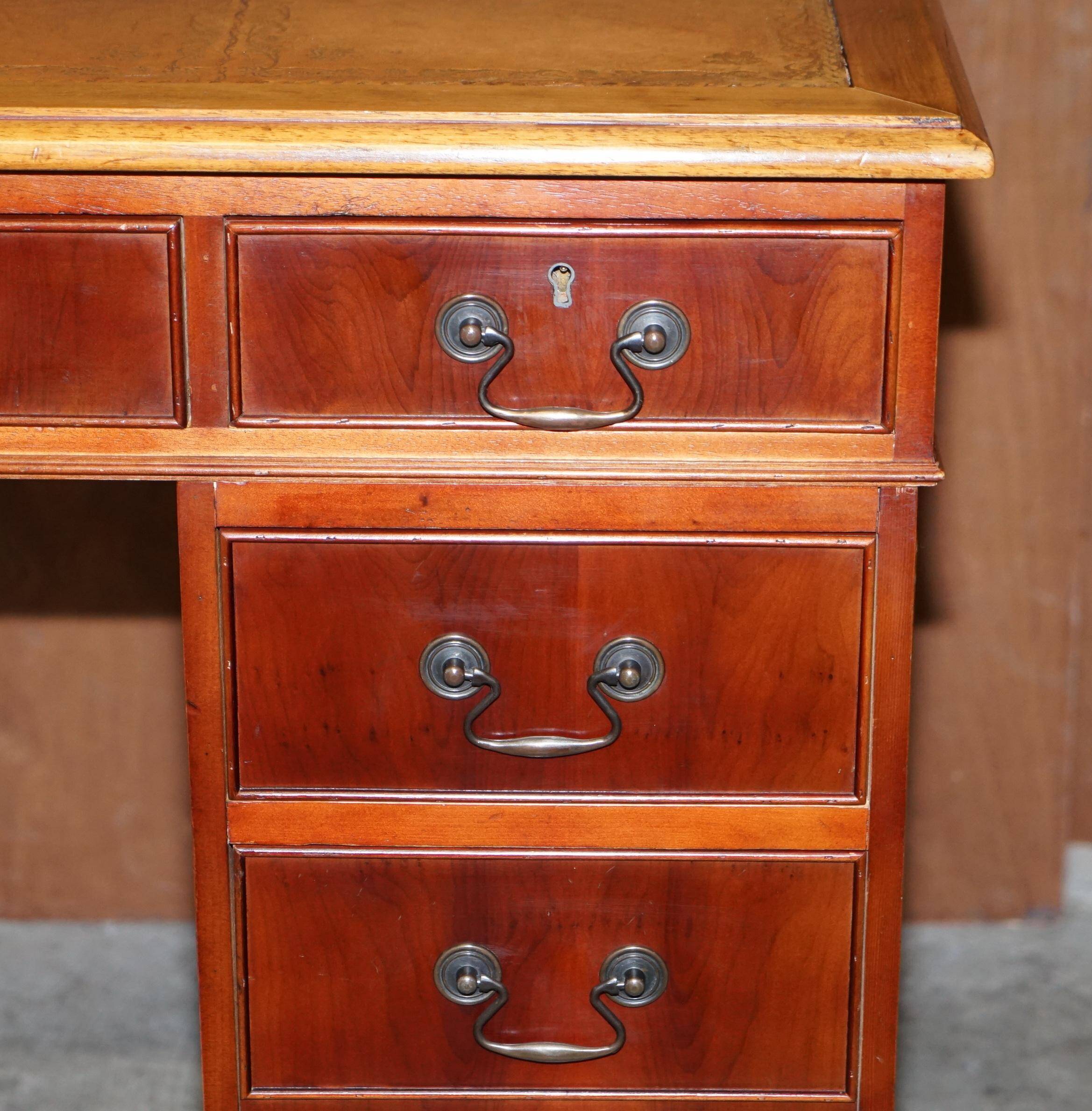 Vintage walnut desk with a leather top and two drawers.
