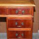 Vintage walnut desk with a leather top and two drawers.