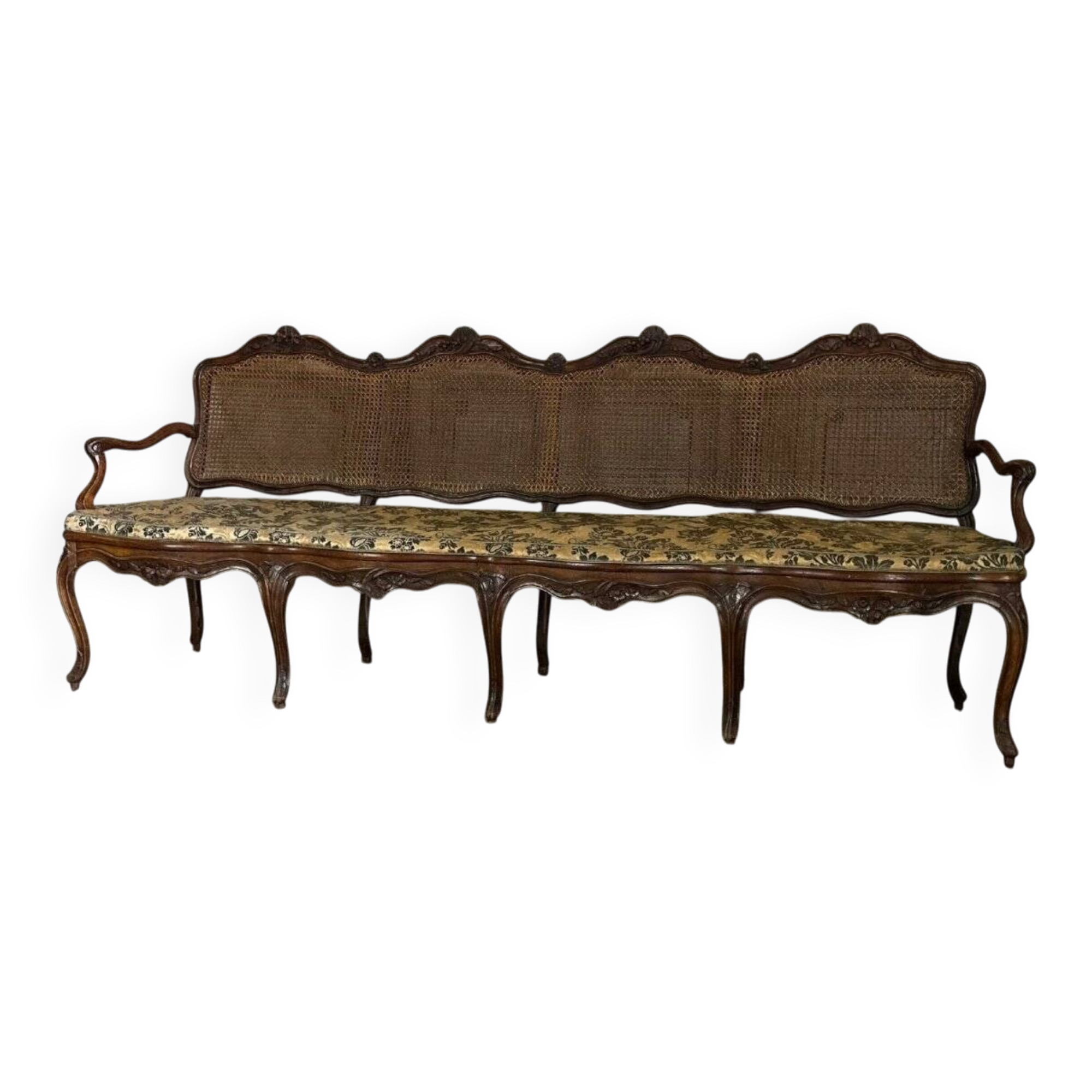 Grande banquette Louis XV en bois naturel mouluré et sculpté, France XVIIIème siècle