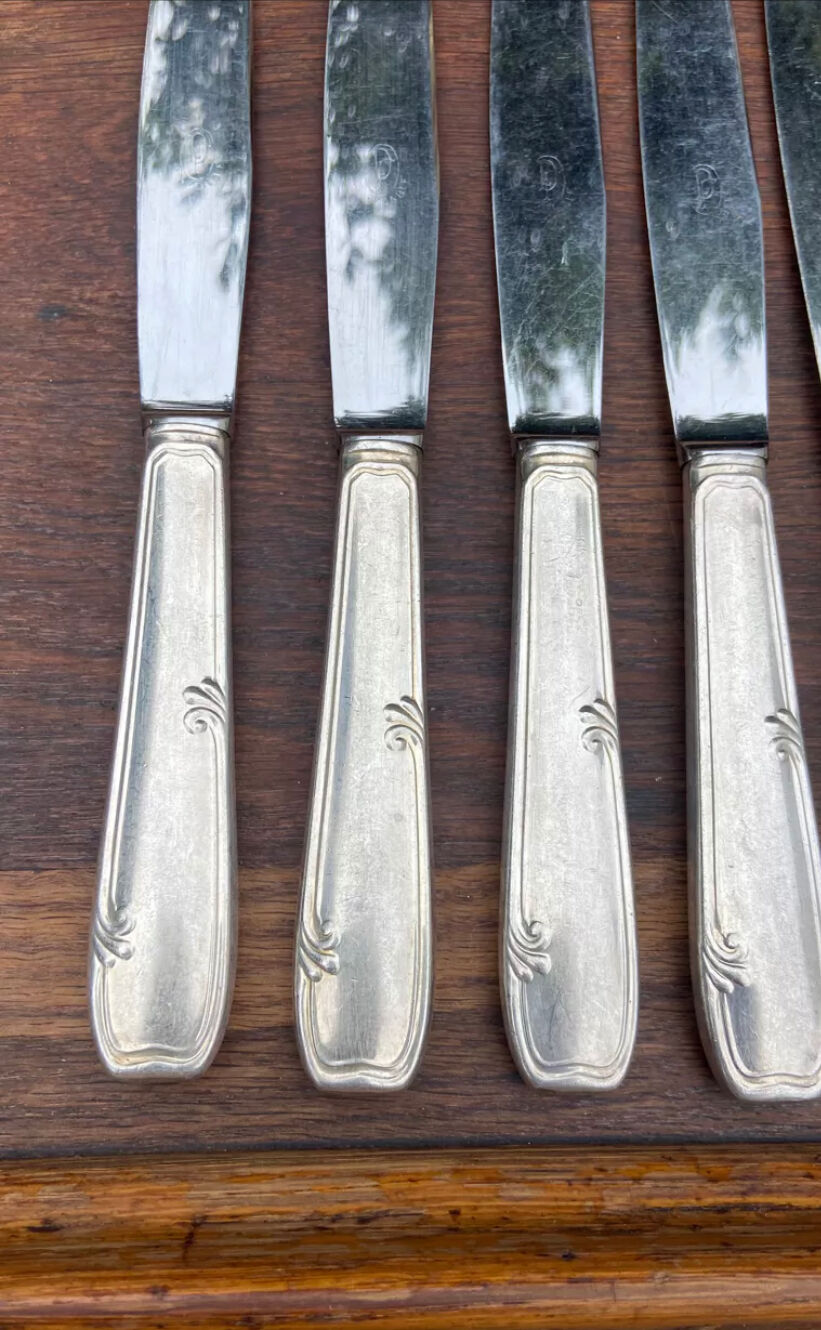 Set of 11 large silver metal knives