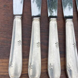 Set of 11 large silver metal knives