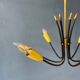 Vintage yellow spider suspension from the 1950s.