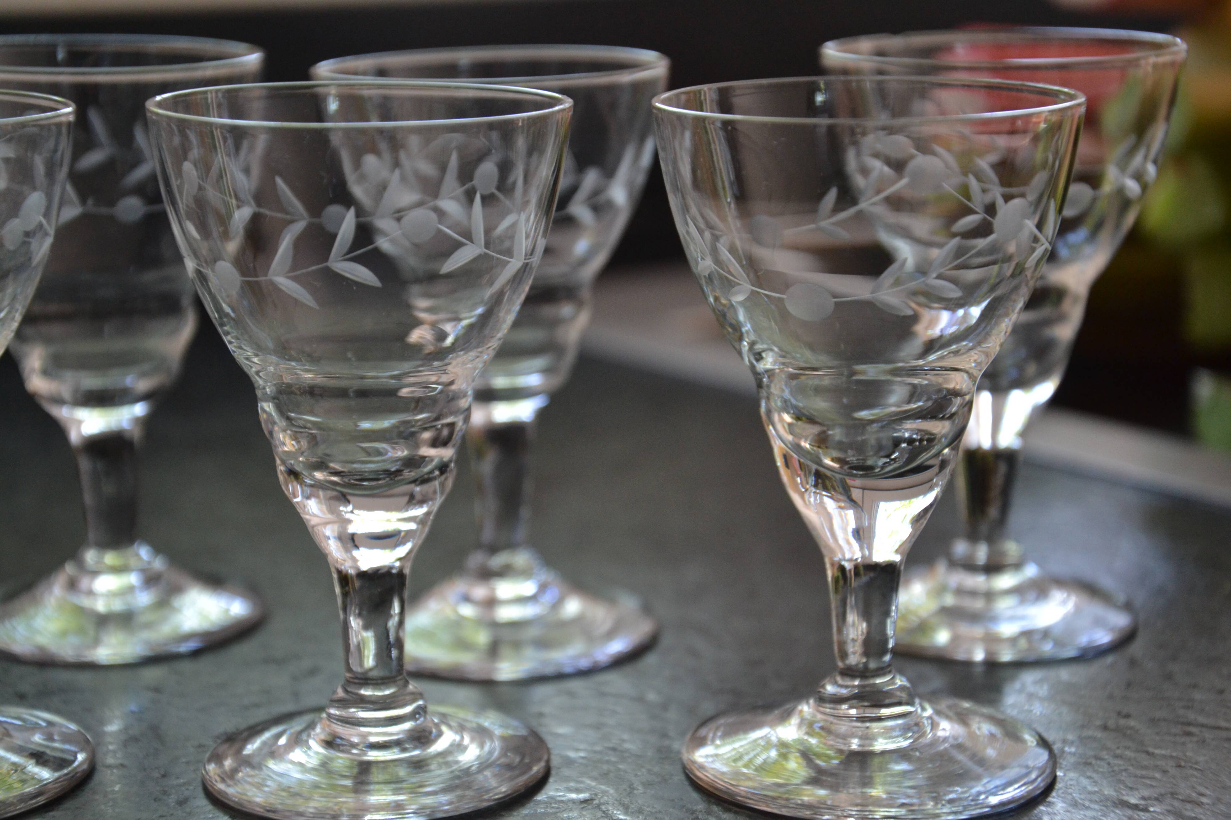 8 small old chiseled glasses
