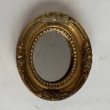 Small old mirror in gilded wood