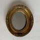 Small old mirror in gilded wood