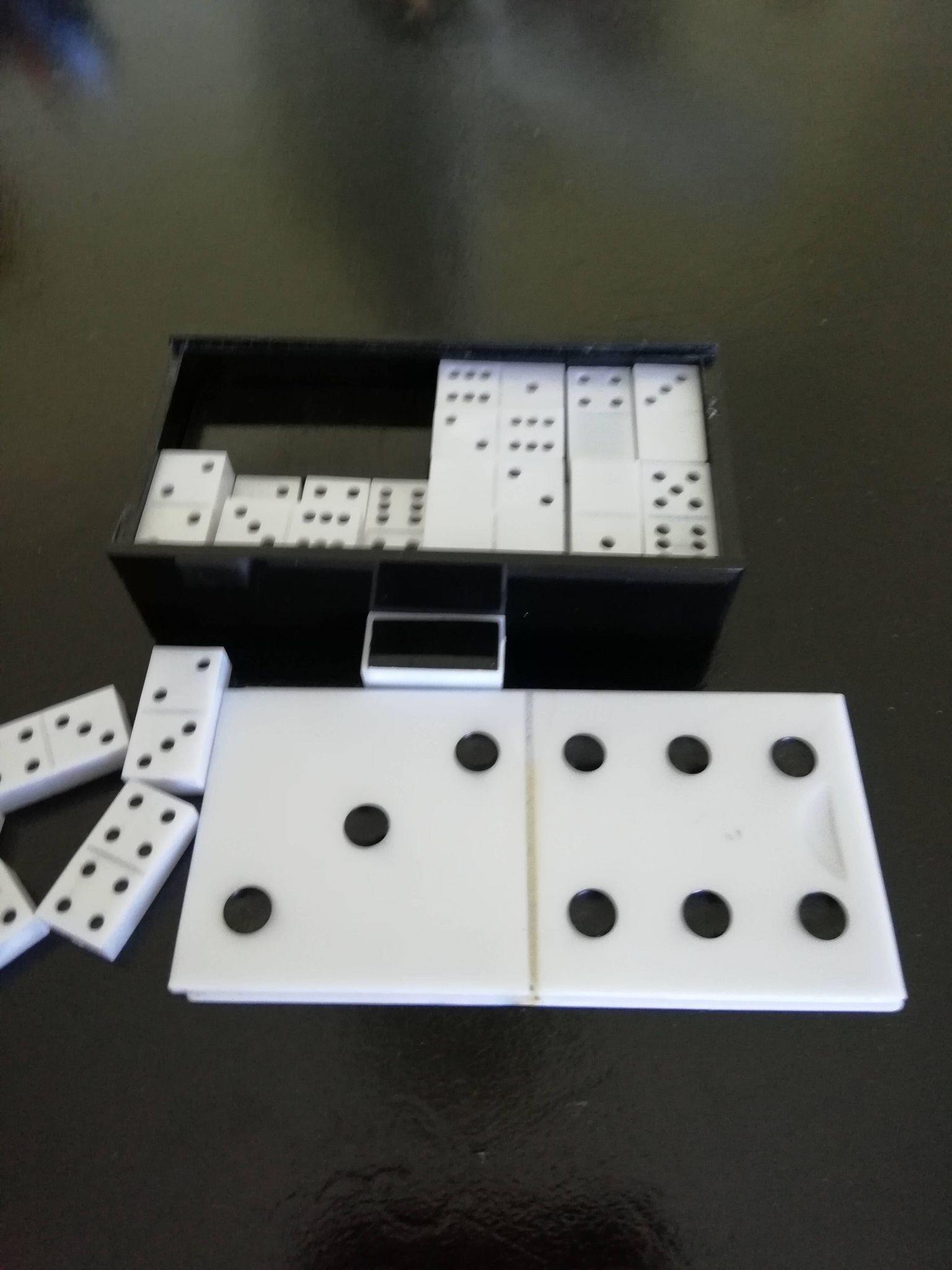 Complete set of Miniature Dominos in a Black and White Box.