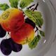 Round dish in Earthenware St Amand decorated with fruit apples and plums
