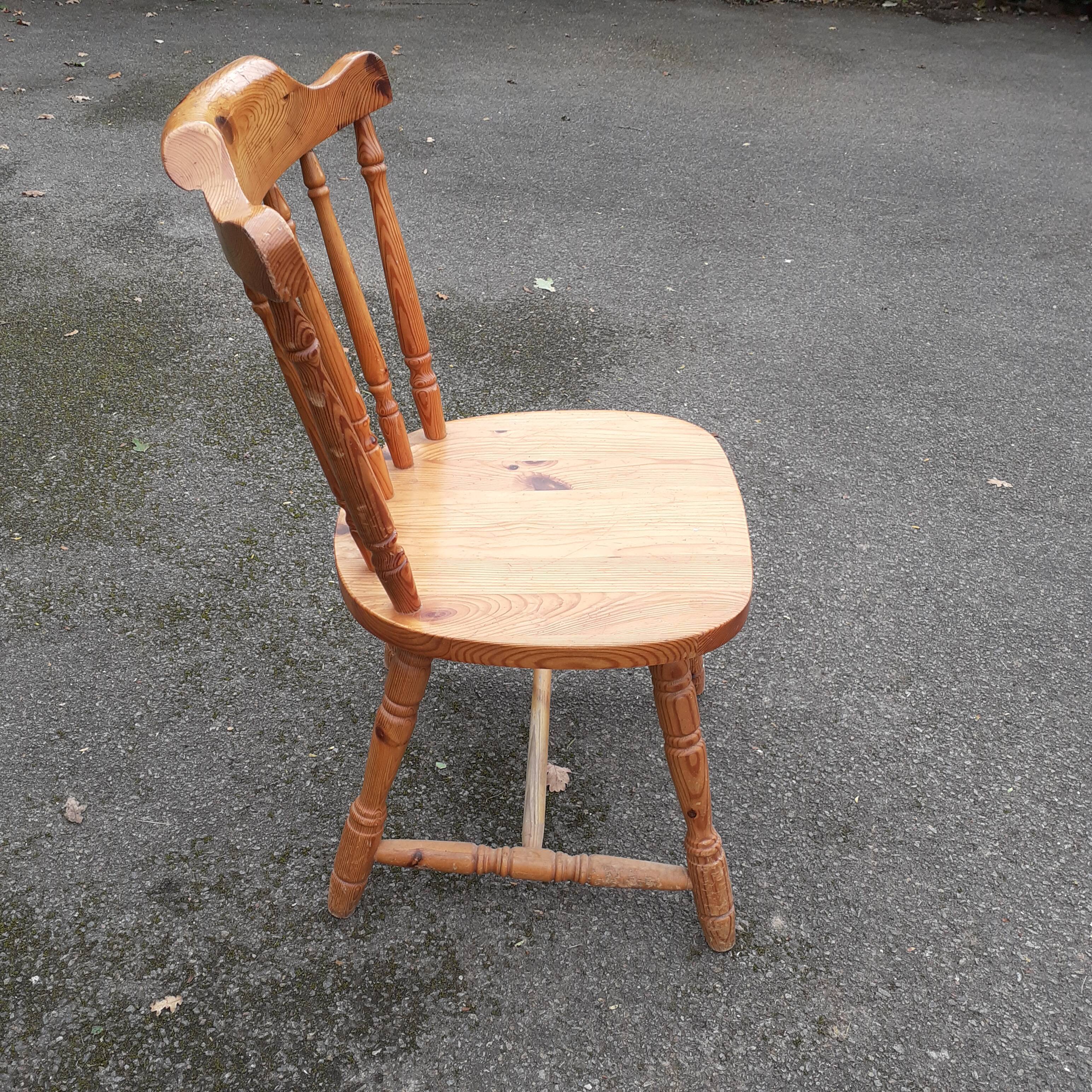 Light-coloured wooden american armchair