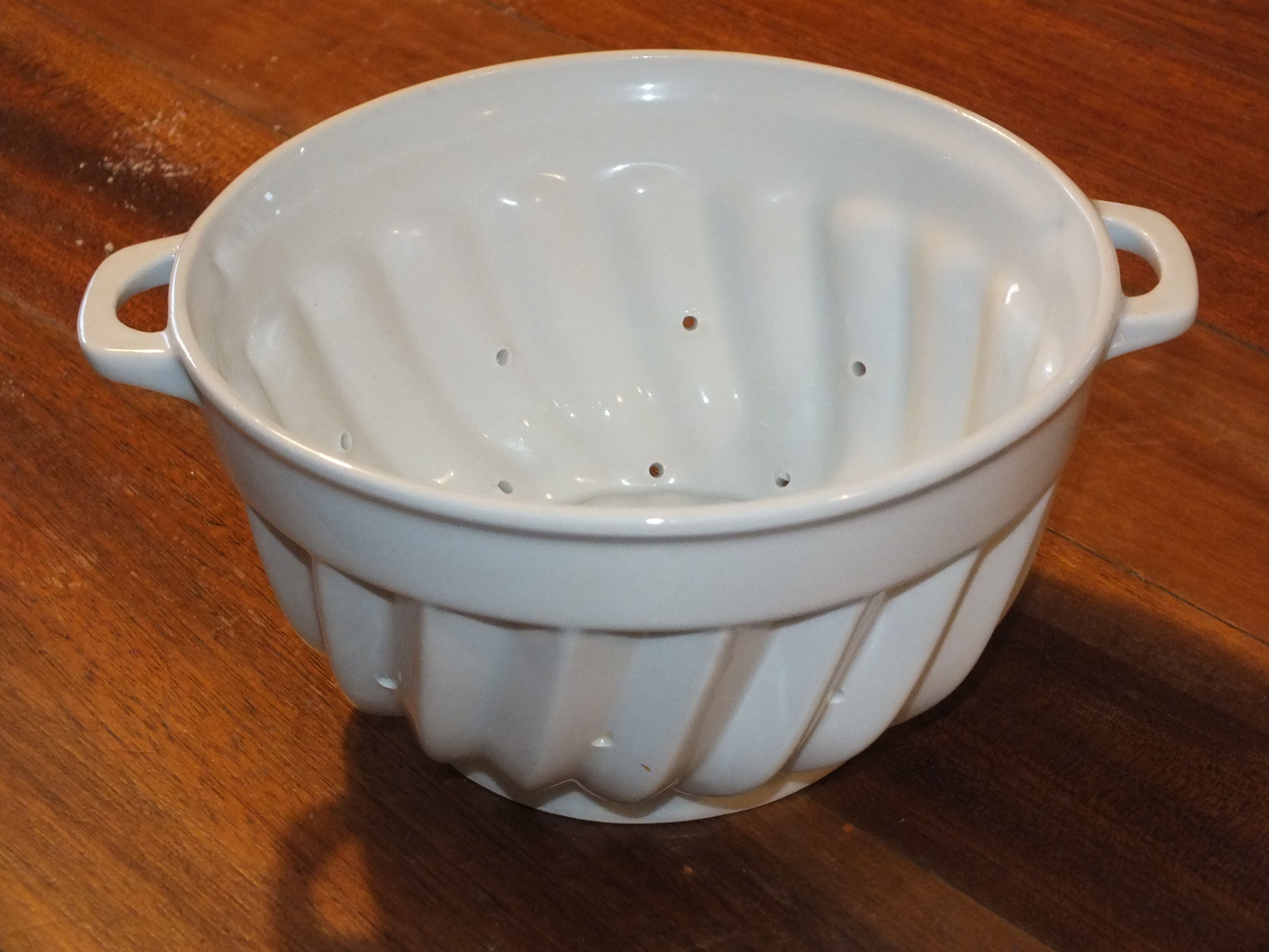 White porcelain strawberry strainer or drainer