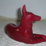 Saint Clement. Dog lying in earthenware