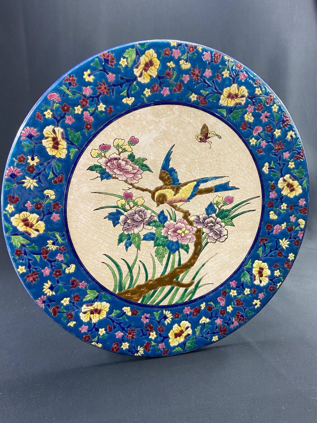 Large circular earthenware dish from Louvière with Longwy style bird decoration