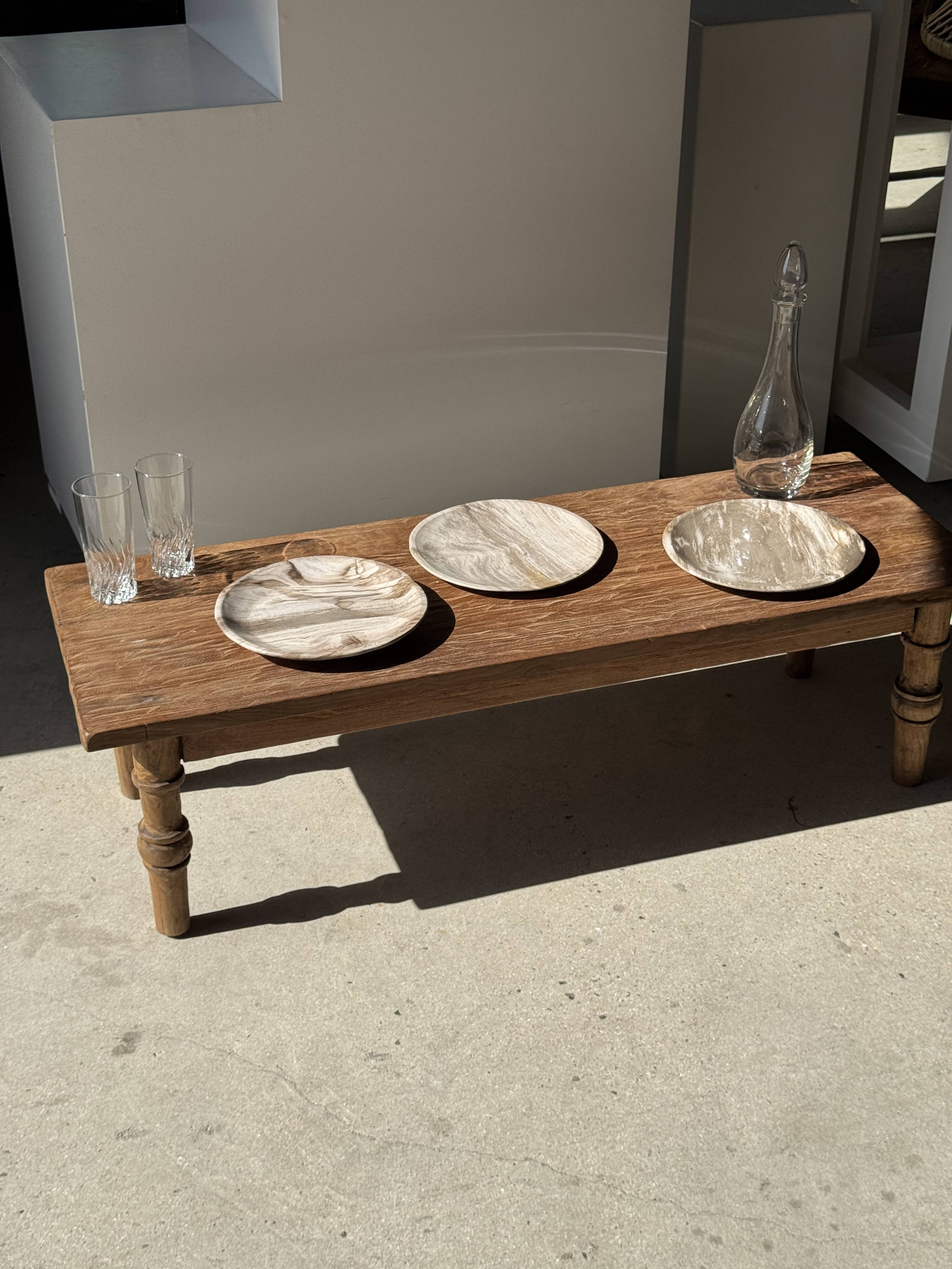 Tray, circular dish or plate made of white striped grey petrified wood.