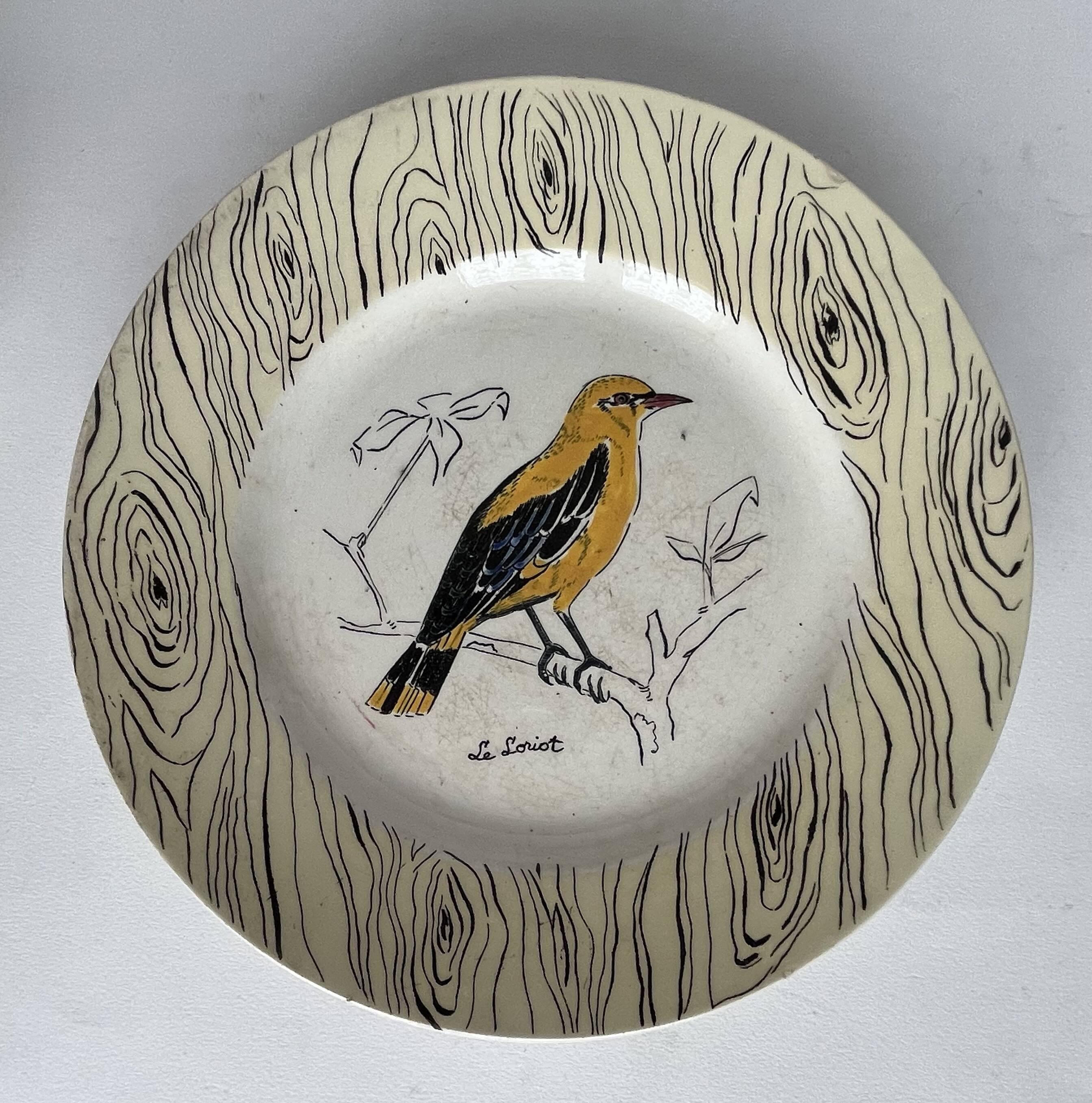 7 antique plates decorated with birds