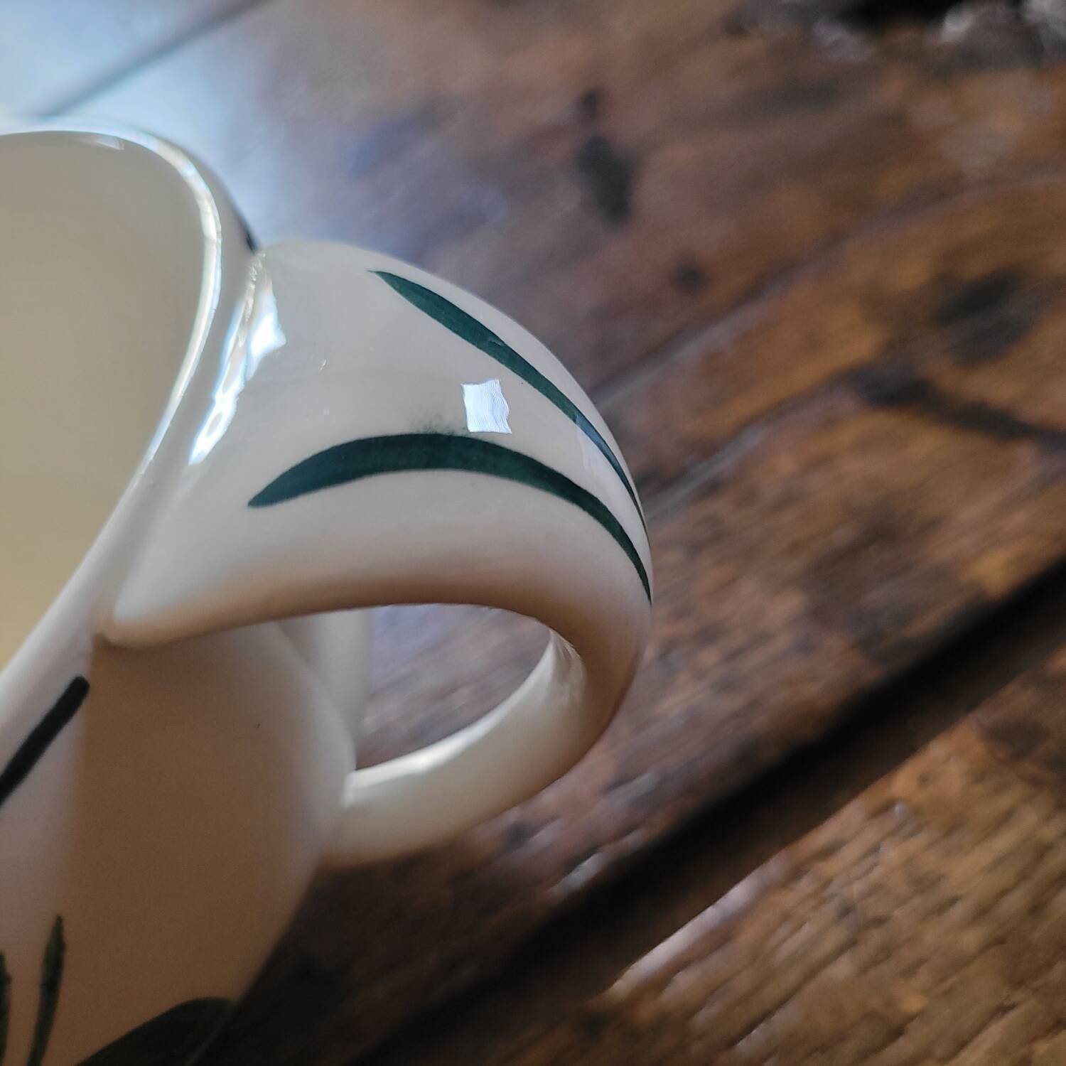 Pair of hand-painted floral-decorated jugs