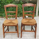 2 solid oak and straw wood chairs