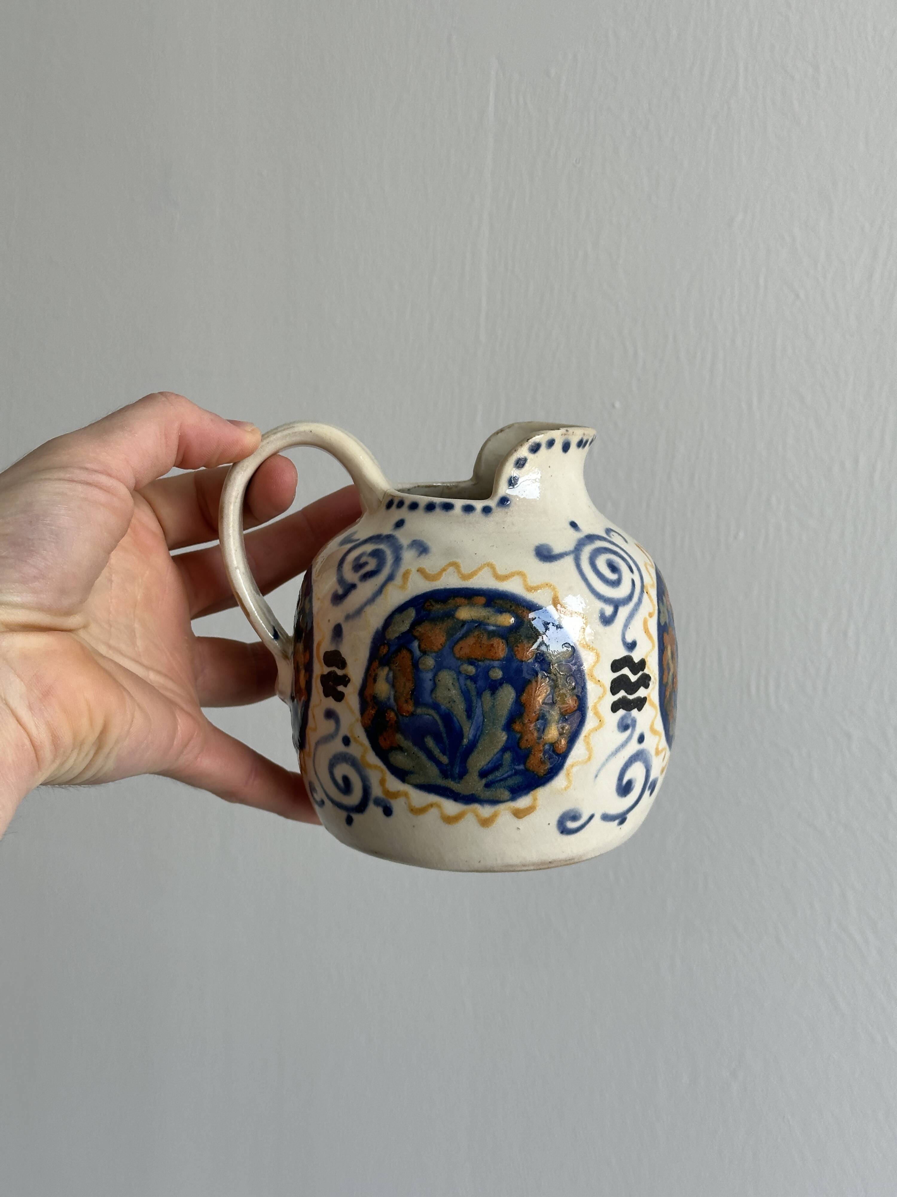 Hand painted ceramic decorative pitcher