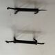 Pair of animal-shaped wrought iron and hammered fire dogs in primitive brutalist style.