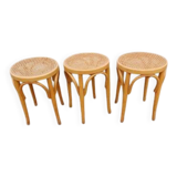 3 wooden and cane stools