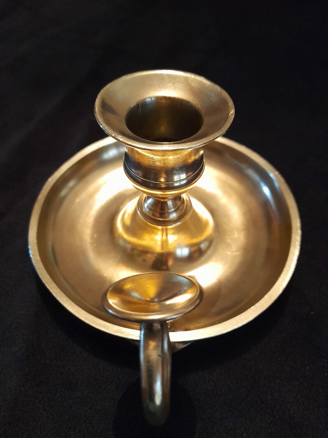 Tailed candle holder.