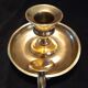 Tailed candle holder.