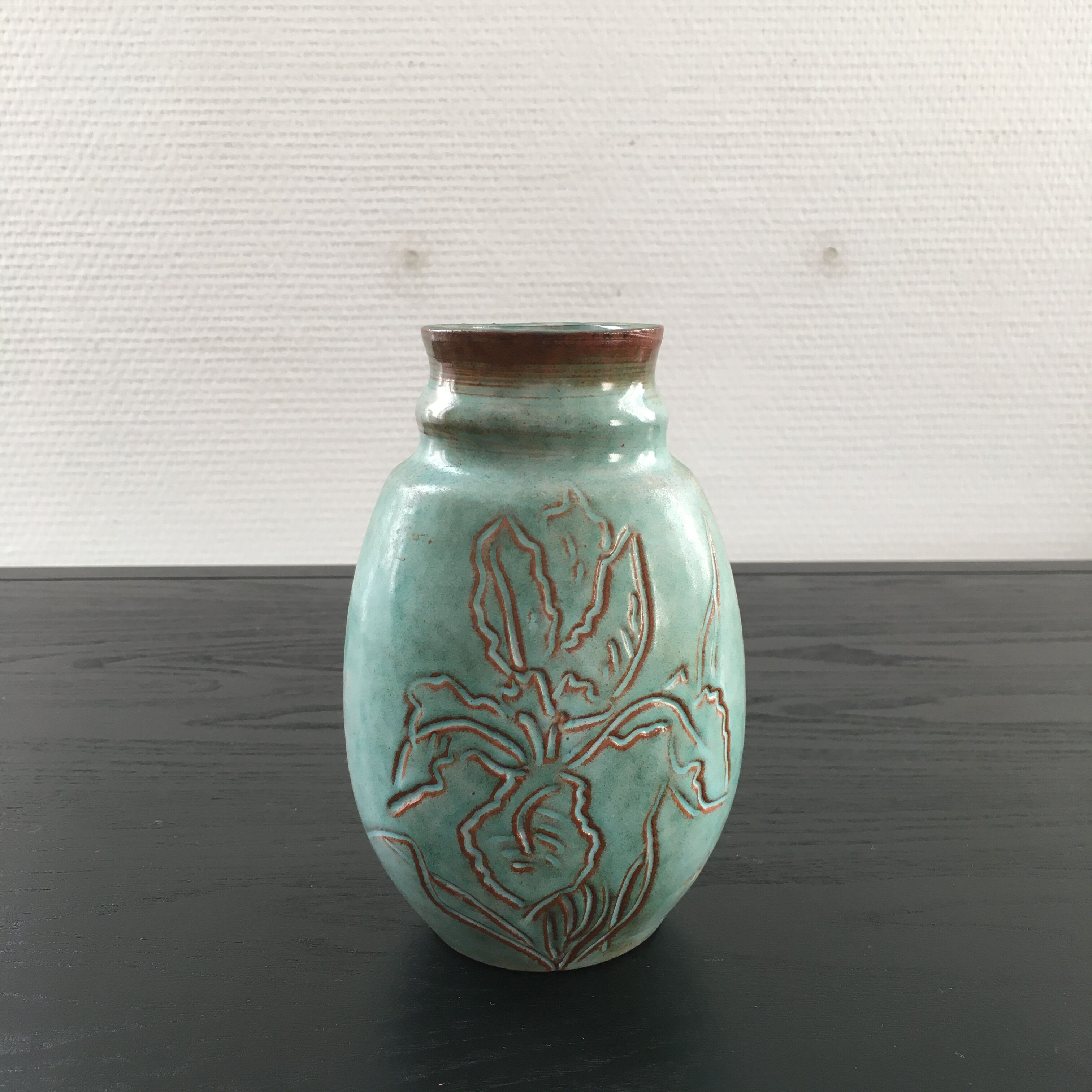 Turquoise vase with iris decoration
