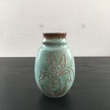 Turquoise vase with iris decor
