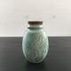 Turquoise vase with iris decoration