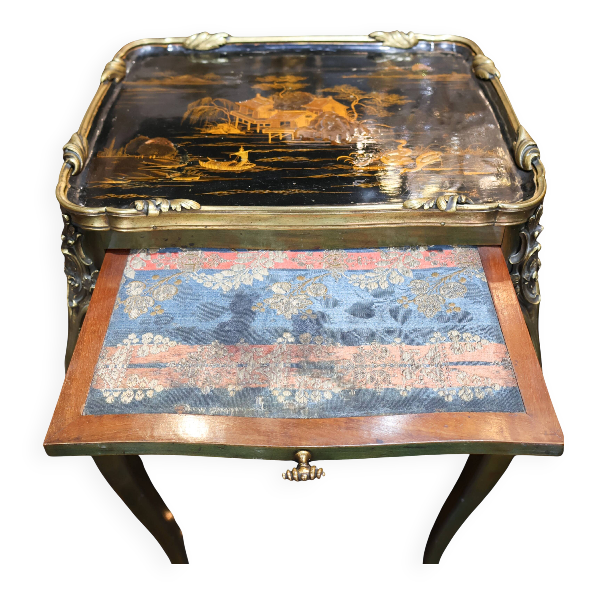 Japanese-style work table from the Napoléon III period in black lacquer and gilded bronze.