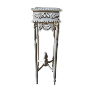 Carved wooden stool with a white patina.