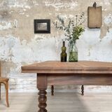 Vintage farmhouse table with turned legs.