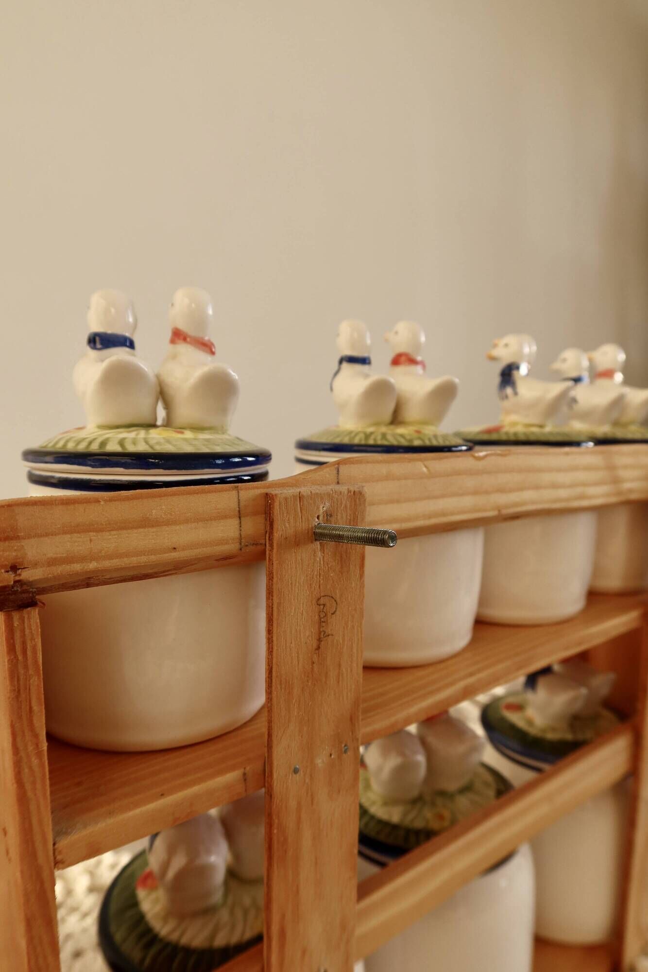 Vintage wooden wall condiment shelf and porcelain pots with geese slip pattern