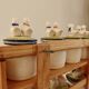Vintage wooden wall condiment shelf and porcelain pots with geese slip pattern
