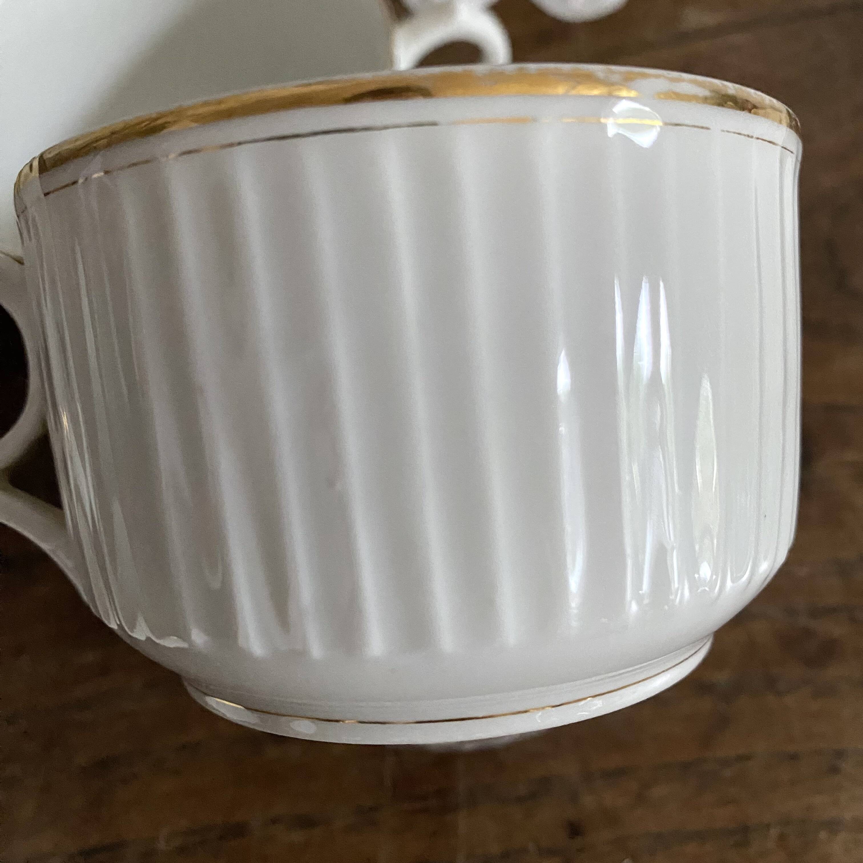 White and gold porcelain cups