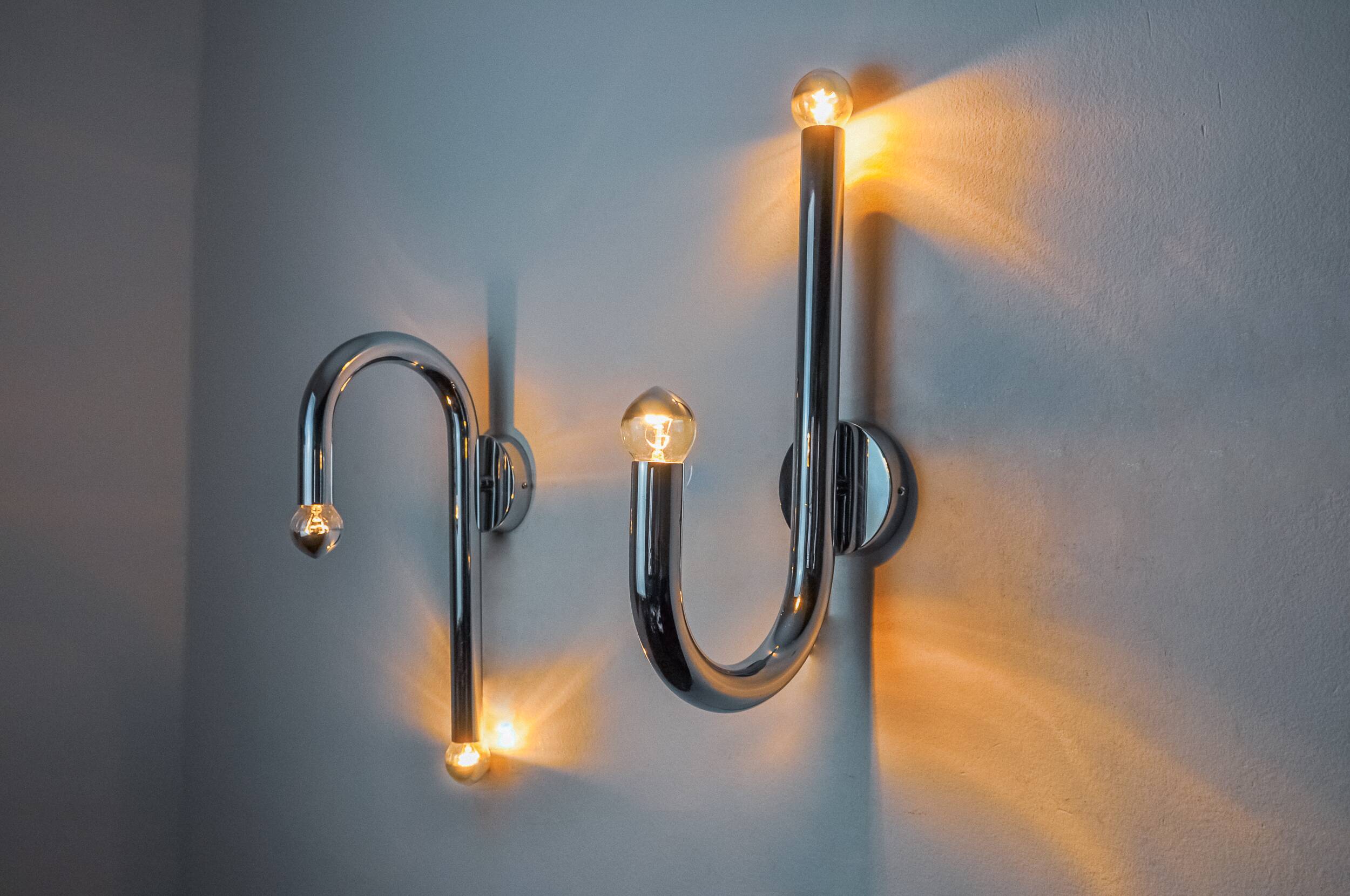 Pair of space-age tubular wall lights, chromed metal, Italy, 1970