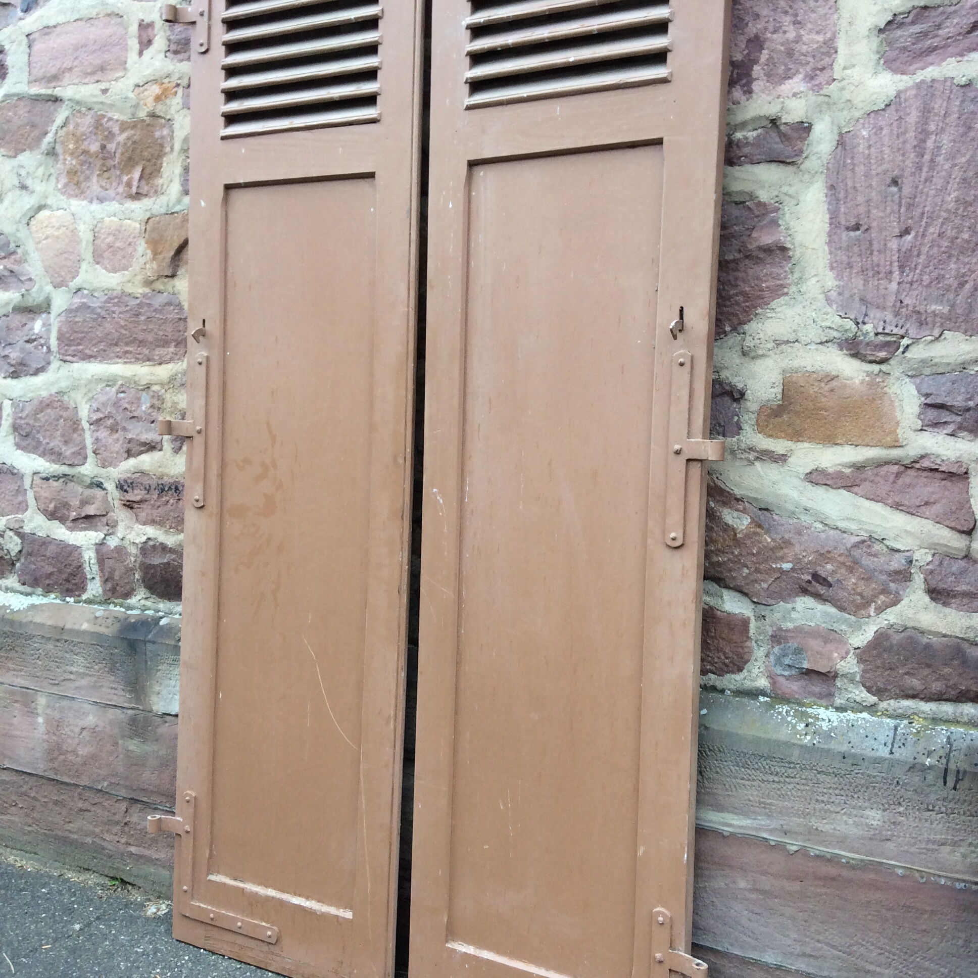 Pair of ancient shutters with wrought iron fittings