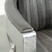 Cow leather aviator design armchair finished with aluminium and rivets