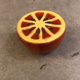 Vintage salt shaker in the shape of an orange marked ermetic