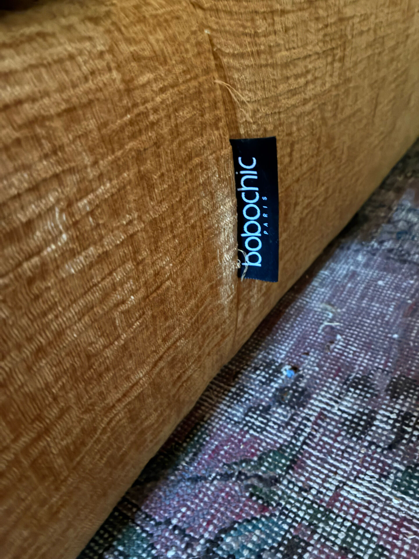 Belem meridian sofa by bobo chic in textured ochre fabric.