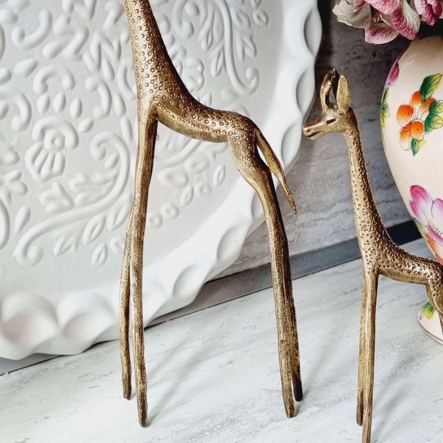 Stylized brass giraffes