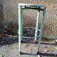 Pair of green factory-style bar stools.
