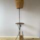 Wrought iron floor lamp with magazine holder and sisal shade, 1950s