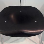 Set of four Egon Eiermann model SE 68 chairs in black lacquered plywood and steel.