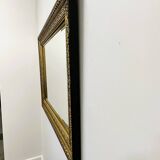 Vintage rectangular classical gold and black mirror. France, 1970s.