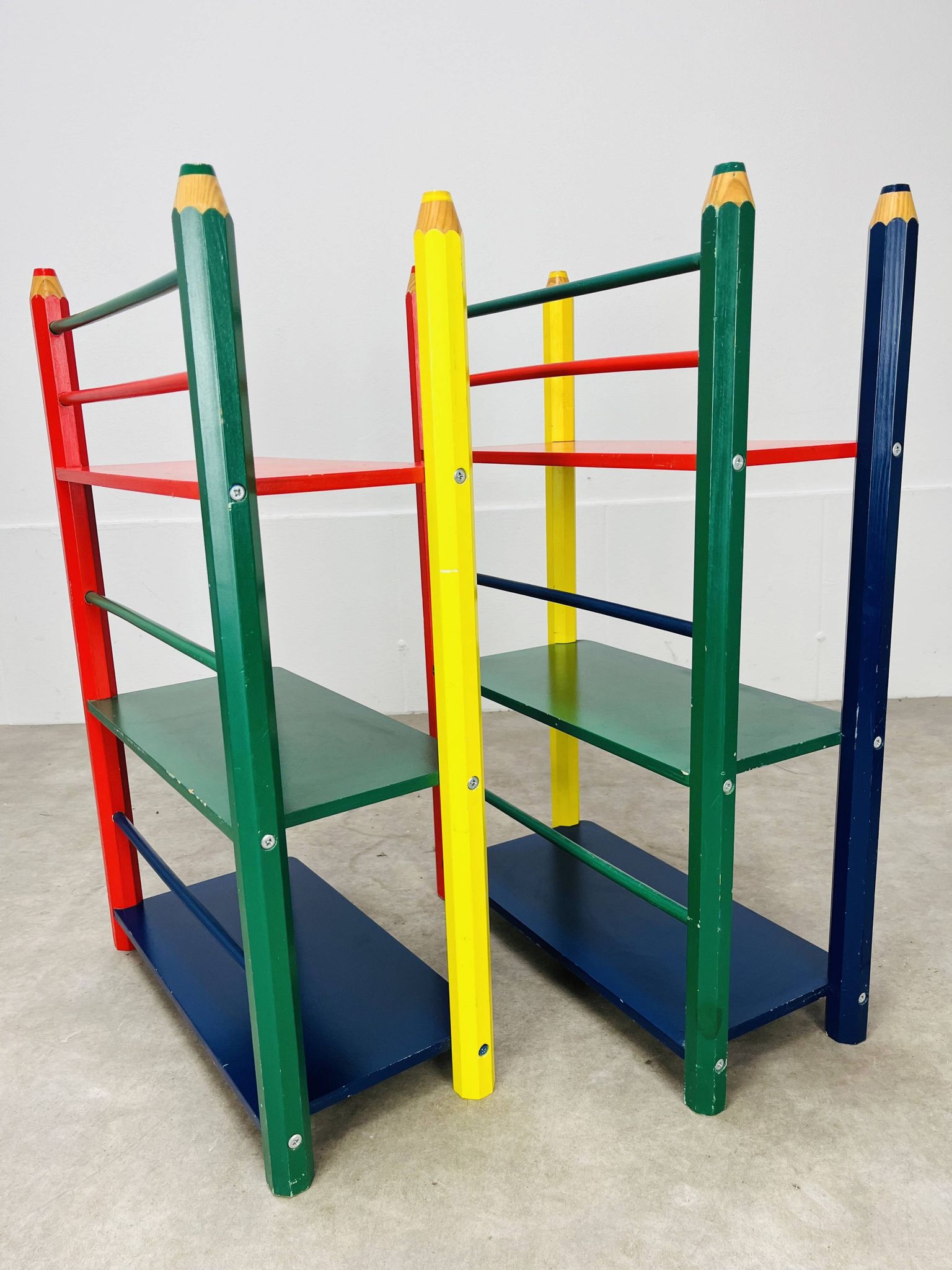 Pair of pencil-style shelves by Pierre Sala for children.