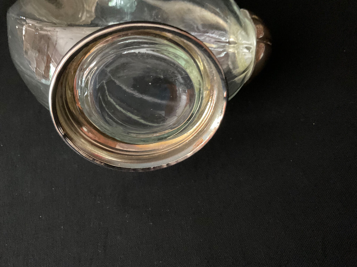 Glass decanter and silver metal duck
