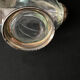 Glass decanter and silver metal duck